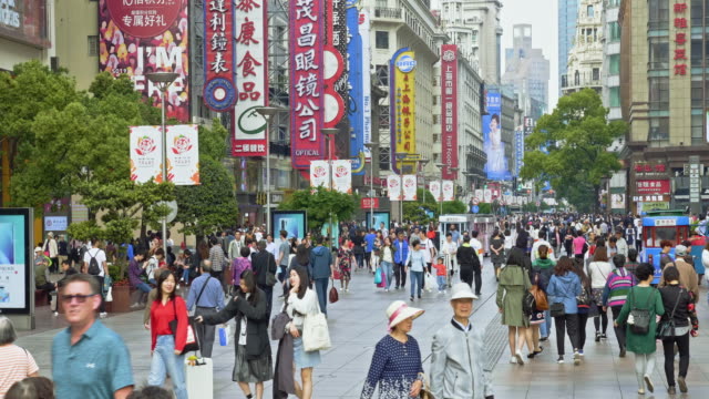people walking on Nanjing Road, Shanghai, China
